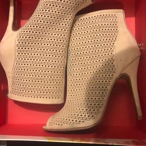 Tan high heeled booties